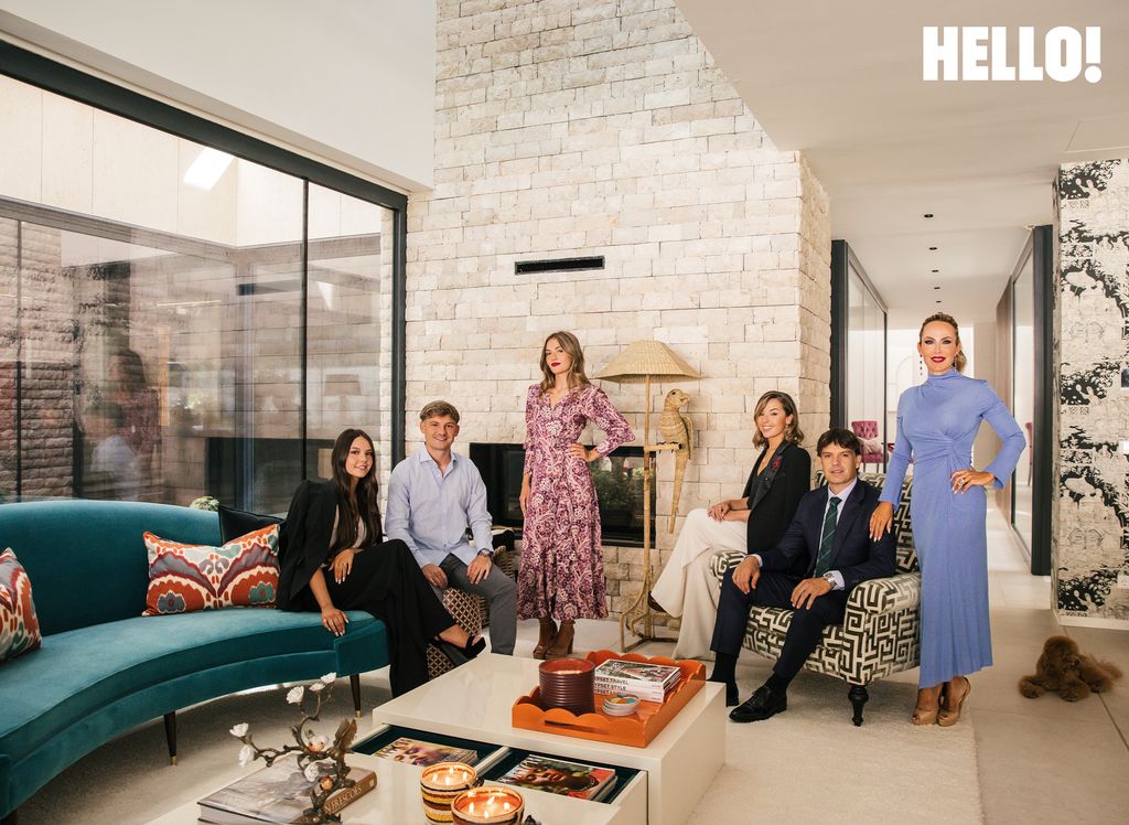 The family relax in the living room inside their three-storey, contemporary-style house