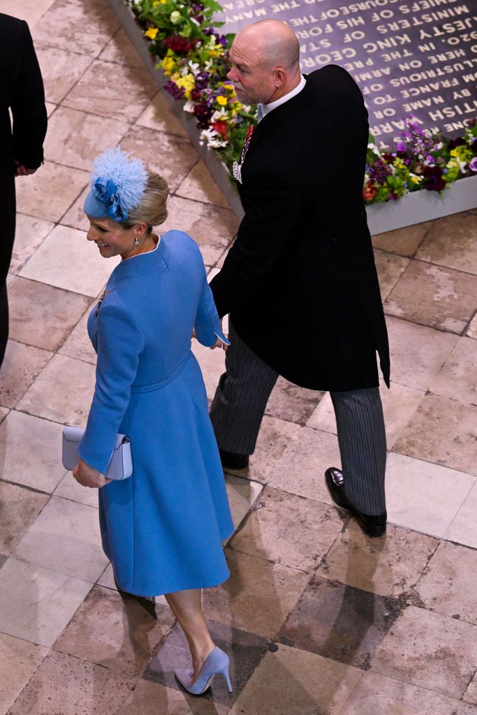 Zara and Mike Tindall holding hands in Westminster Abbey