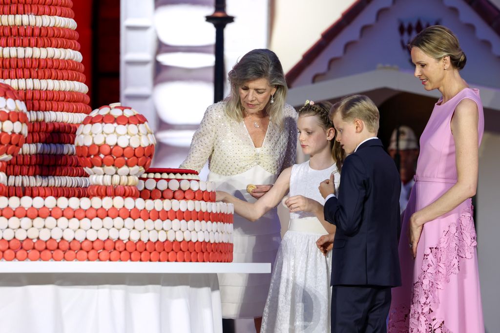 Princess Caroline, Princess Gabriella of Monaco, Prince Jacques of Monaco and Princess Charlene of Monaco cut the cake 