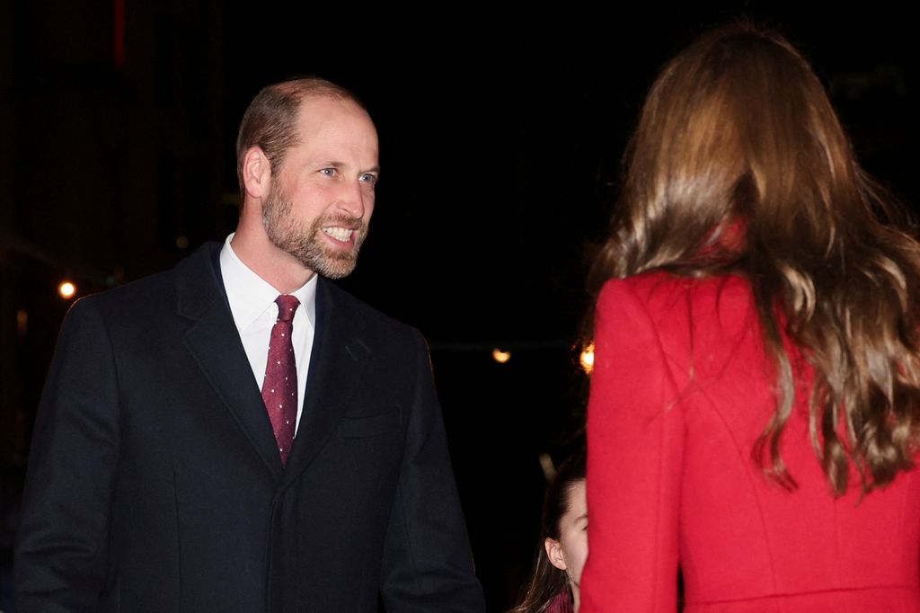 William beamed at his wife as they arrived at the concert