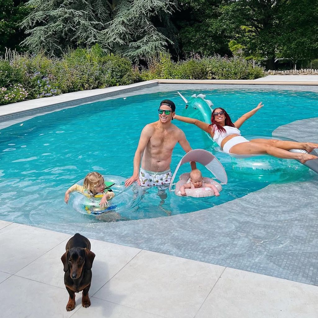 Joe Swash, Stacey Solomon and their kids playing in the pool in the garden