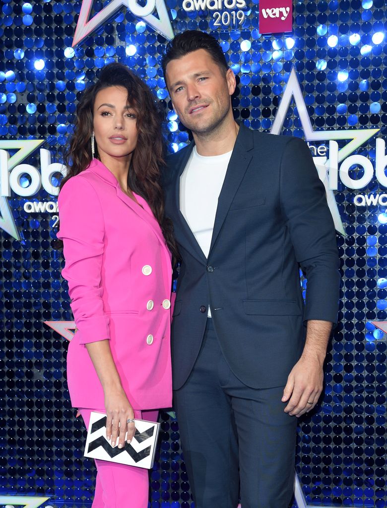 Michelle Keegan in pink suit and Mark Wright in suit