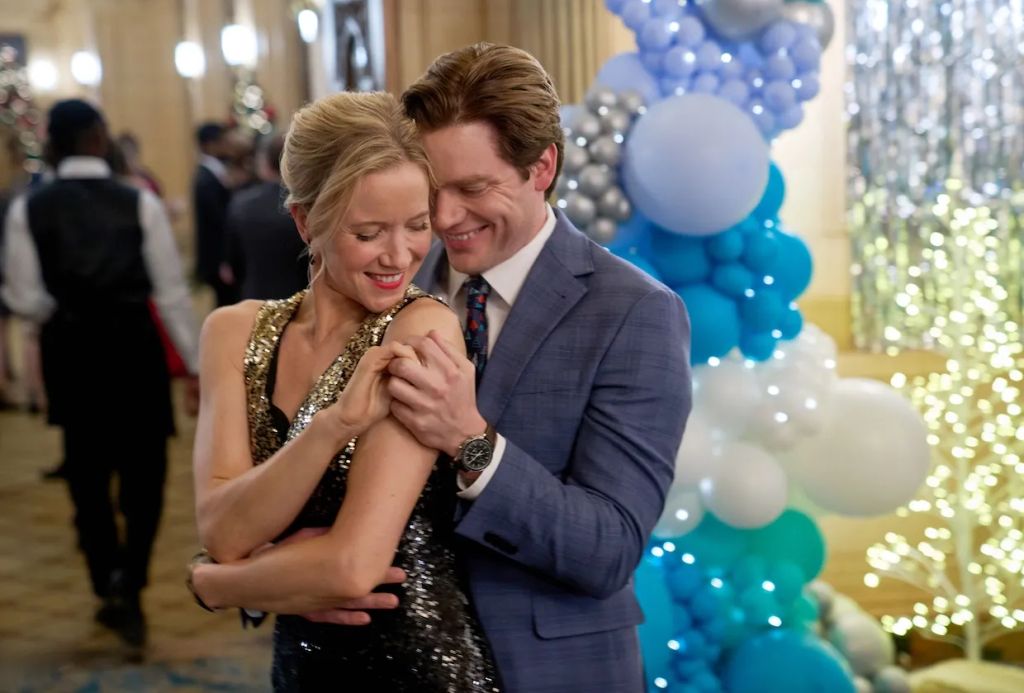 Jessy Schram and Dominic Sherwood in A Suite Christmas