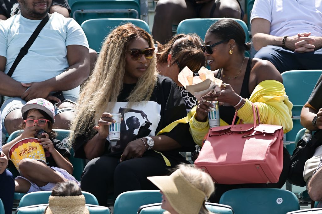 Serena Williams watching sister Venus Williams play tennis