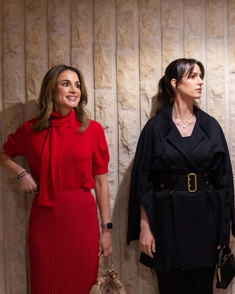 Queen Rania in red outfit with princess rajwa in black