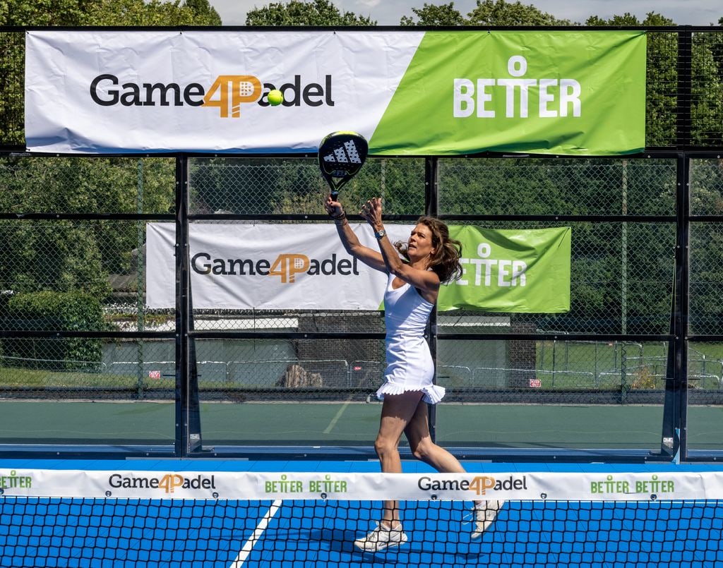 Annabel Croft playing padel in a white dress