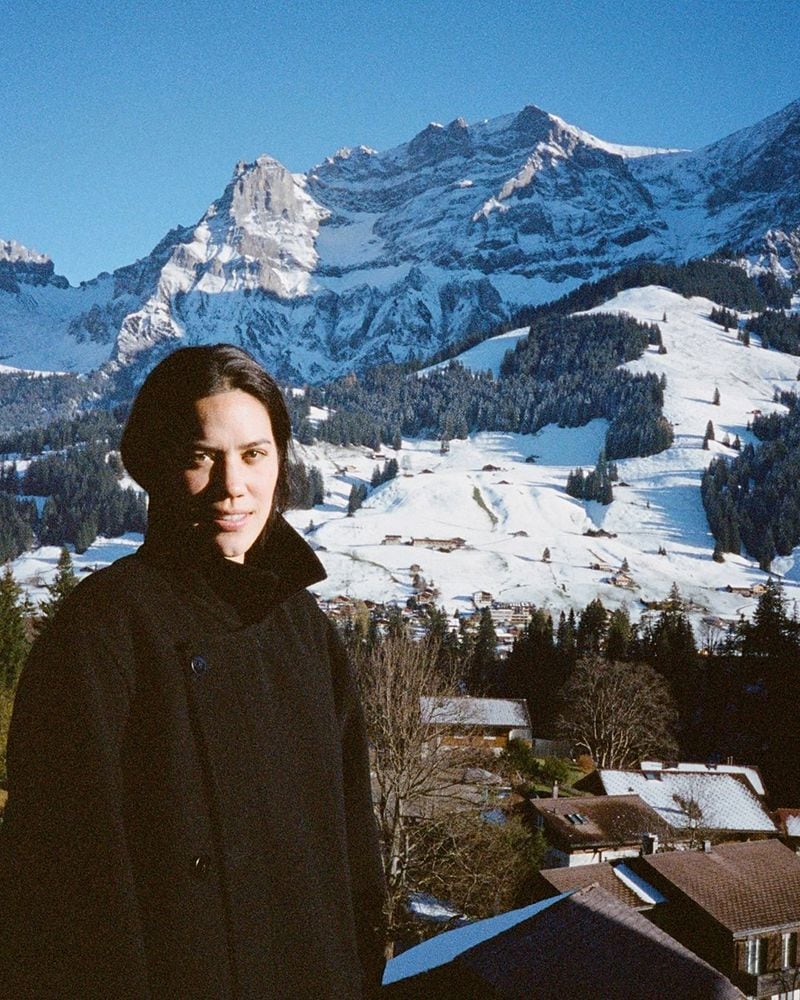 Anna Blundell standing by mountains