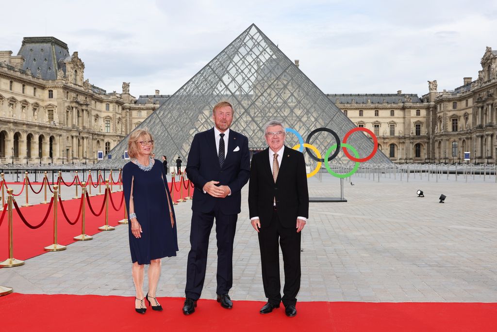 IOC President Thomas Bach and his wife Claudia Bach pose with King the Netherlands Willem-Alexander as they attend the IOC & Elysee Dinner at the Louvre ahead of the Paris 2024 Olympic Opening Ceremony on July 25, 2024 in Paris, France