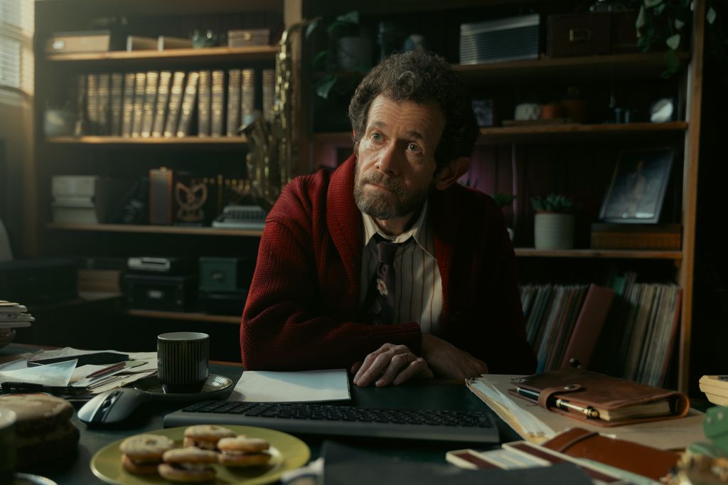 man sitting at desk in office