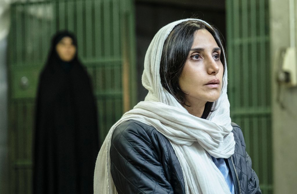 A photo of a woman wearing a white headscarf 