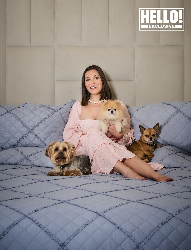 Lilia Mascolo posing on bed with dogs at Surrey home Summerdown Manor's 