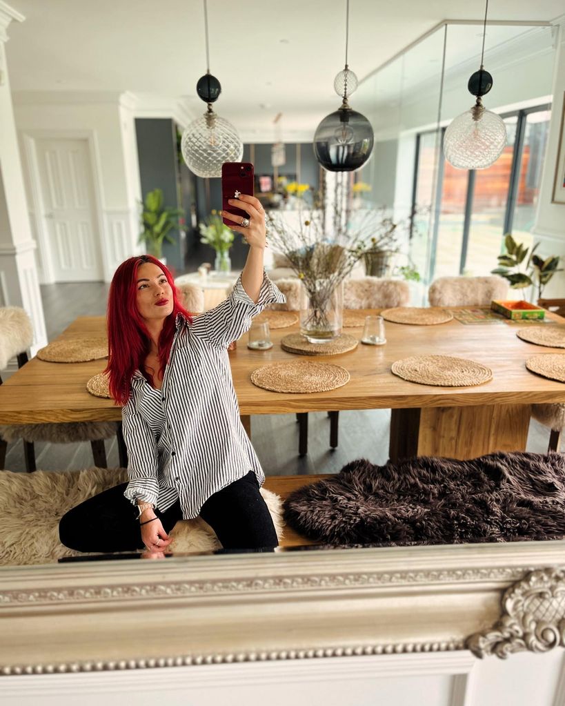 Dianne Buswell seated at her dining room table