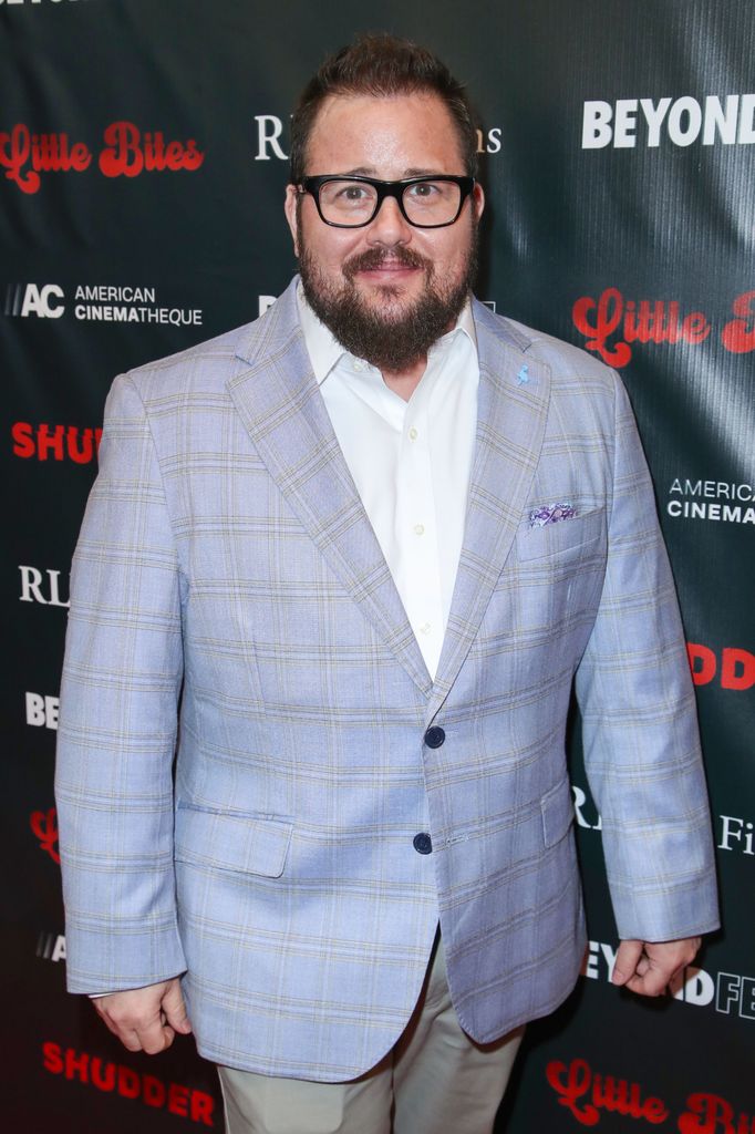 Chaz Bono in a blue jacket on the red carpet