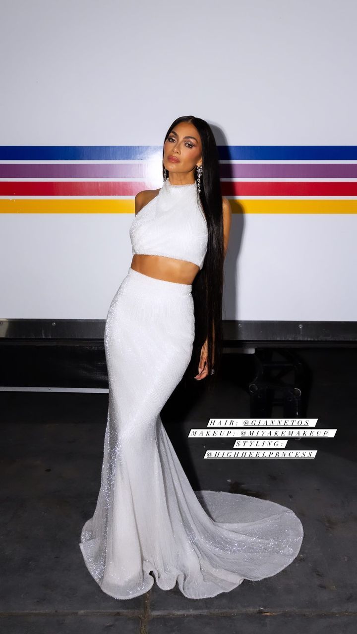 Nicole Scherzinger in white crop and skirt with long hair