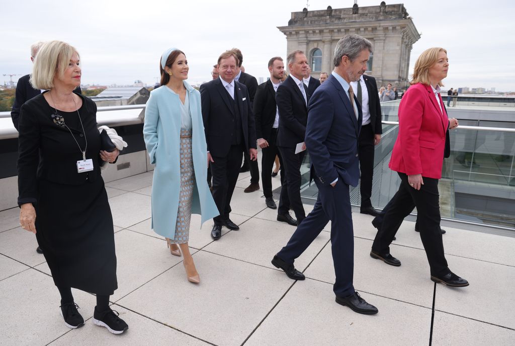 Queen Mary accompanied by Bundestag President Baerbel Bas (R) as they walk on the rooftop terrace 