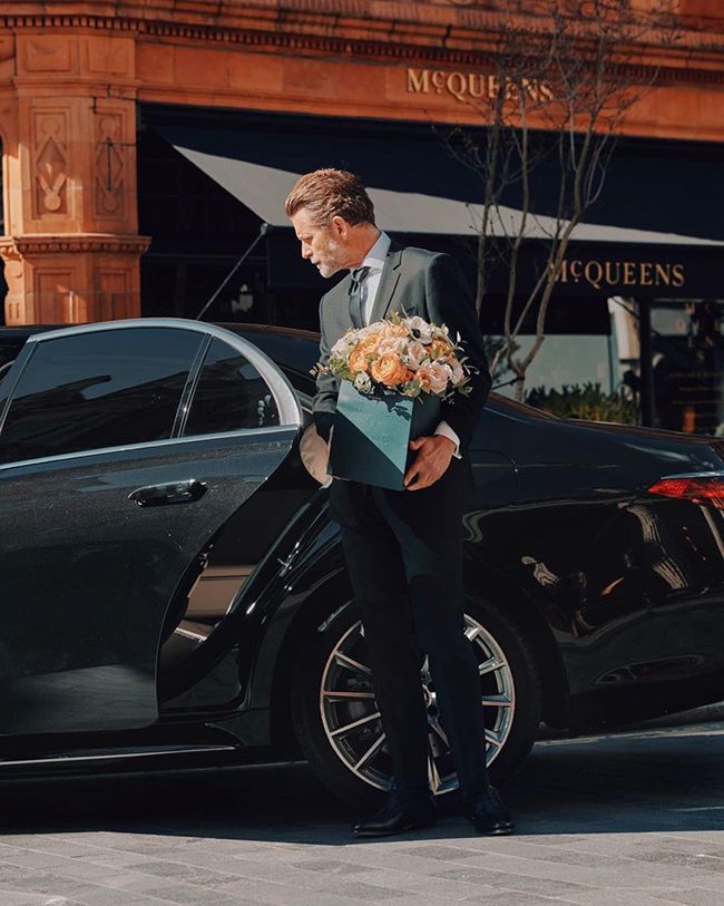 Wheely chauffeur delivering a flower bouquet