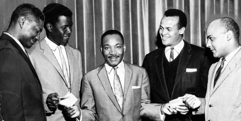 Martin Luther King Jr. poses with Harry Belafonte and others