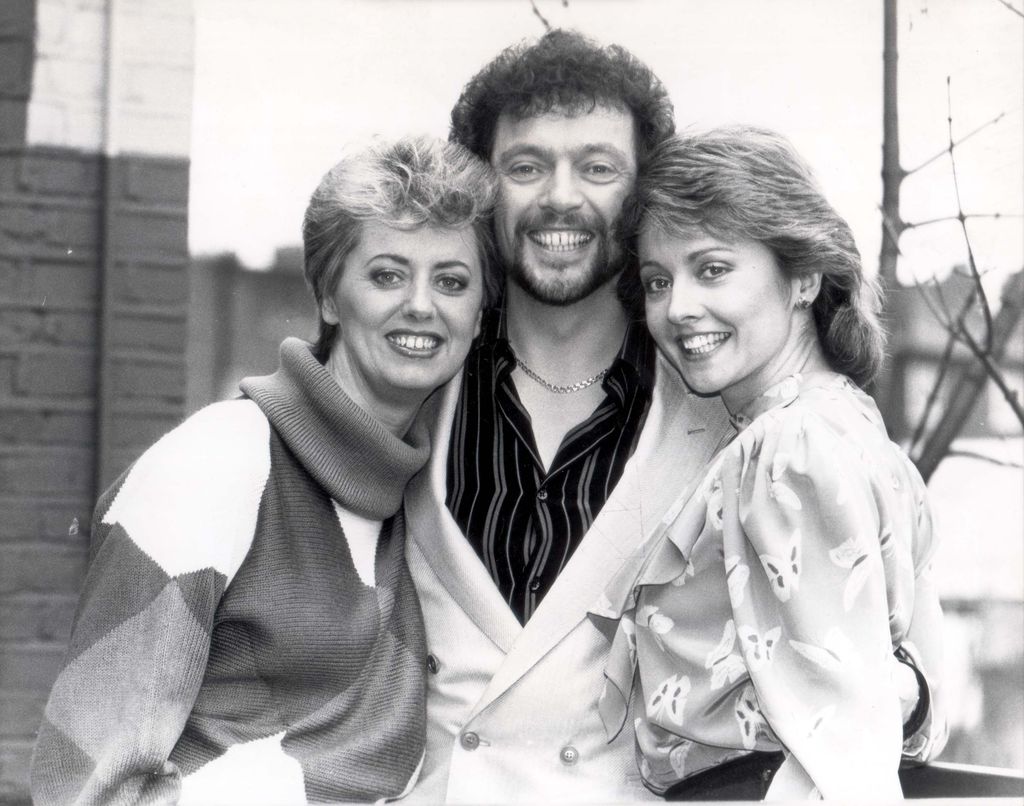 three tv presenters in black and white phot