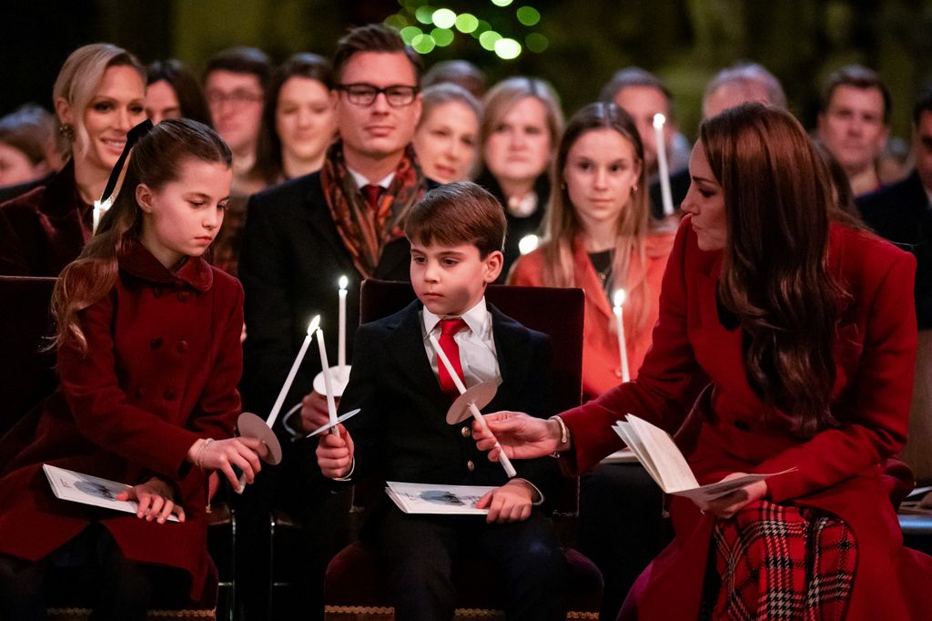 The gentleman was seated just behind the royal family