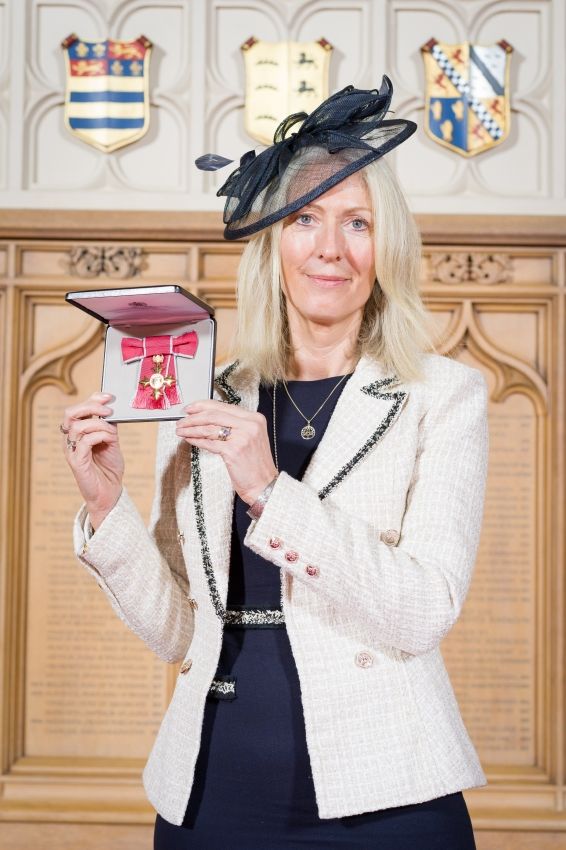 Rachel Watkyn posing with her OBE for Services to Sustainability