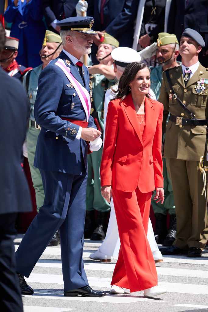 King Felipe VI of Spain and Queen Letizia in red suit