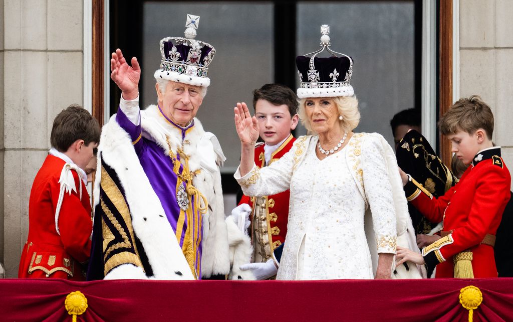 King Charles and Camilla wave on the balcony 