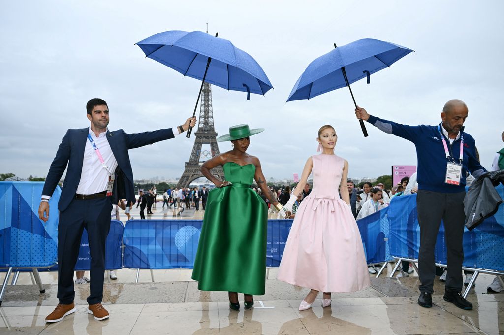 British actress and singer Cynthia Erivo (CL) and US' singer Ariana Grande (CR) arrive ahead of the opening ceremony of the Paris 2024 Olympic Games in Paris on July 26, 2024