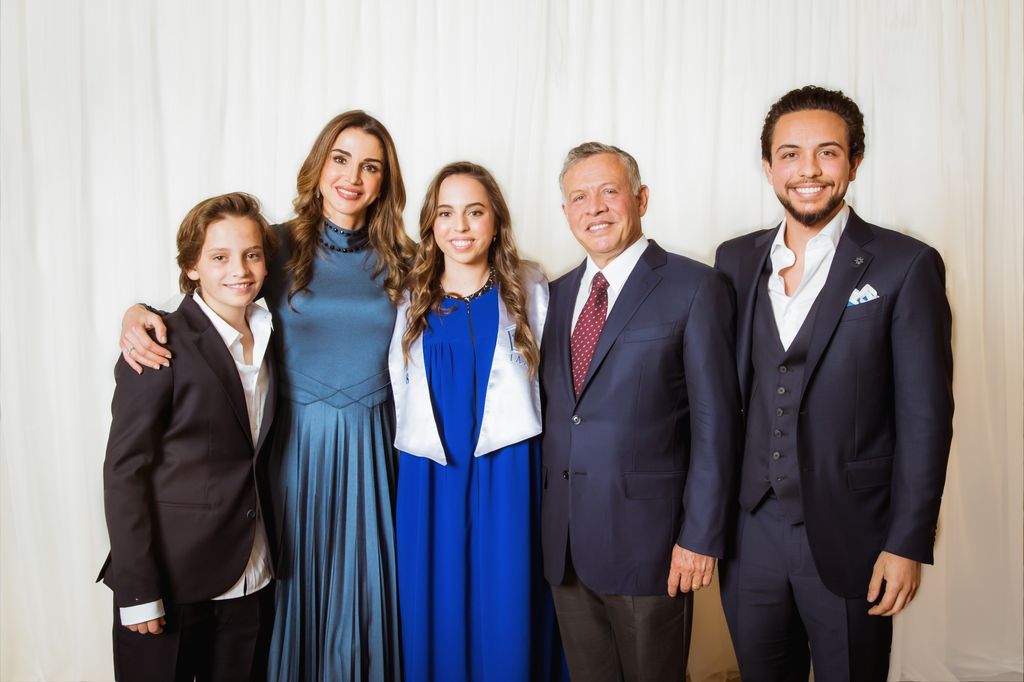 Jordan's King Abdullah II (2nd-R), his wife Queen Rania and (2nd-L), Crown Prince Al Hussein (R) and Prince Hashem (L) attend the graduation ceremony of Princess Salma (C) from the International Academy