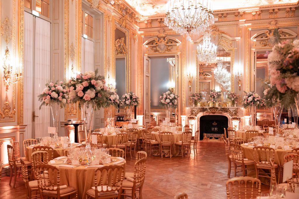 opulent ballroom with tables set with flowers