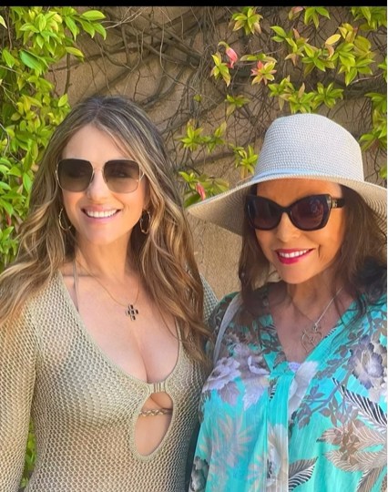A photo of Joan Collins and Elizabeth Hurley
