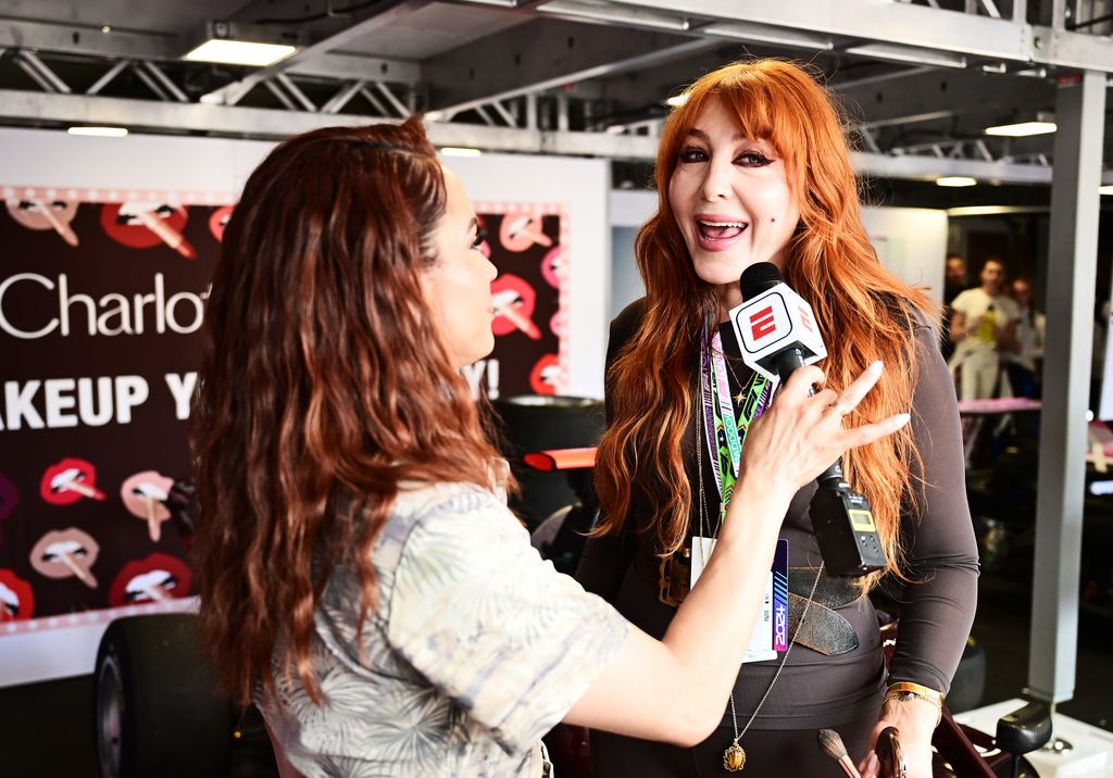 Charlotte Tilbury talks to the media in the Paddock prior to race 1 during Round 2 Miami of the F1 Academy at Miami International Autodrome on May 04, 2024 in Miami, Florida