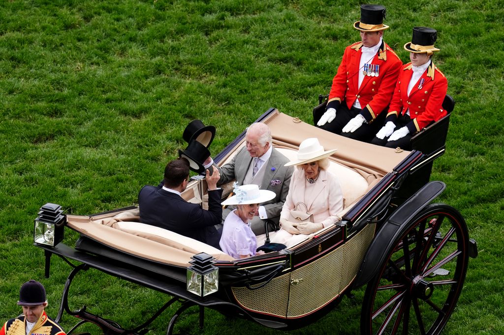 King Charles III, Queen Camilla, Sheikh Hamad bin Khalifa Al Thani and Lady Charles Spencer-Churchill arrive by carriage on day five of Royal Ascot at Ascot Racecourse, Berkshire.