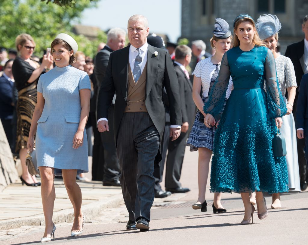 Prince Andrew flanked by his two daughters Princess Eugenie and Princess Beatrice