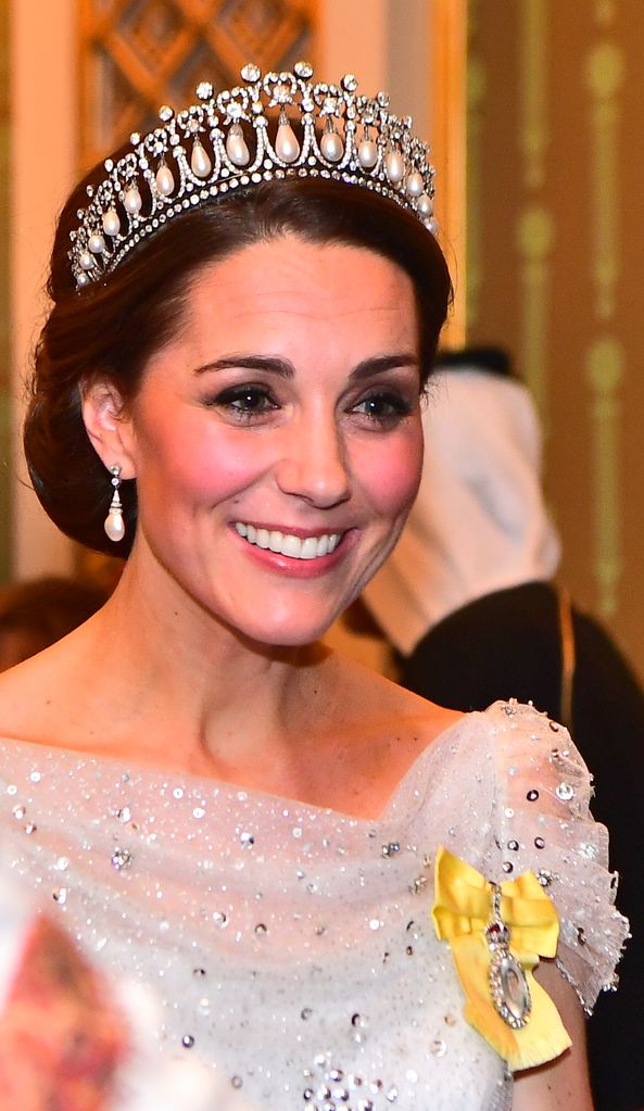 Kate Middleton wearing white embellished dress at diplomatic reception