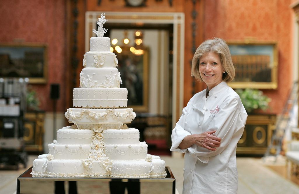  Fiona Cairns stands proudly next to the Royal Wedding cake that she and her team made for Prince William and Kate Middleton, in the Picture Gallery of Buckingham Palace in central London, today.