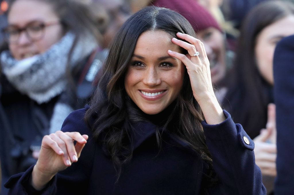 woman in navy coat outside 