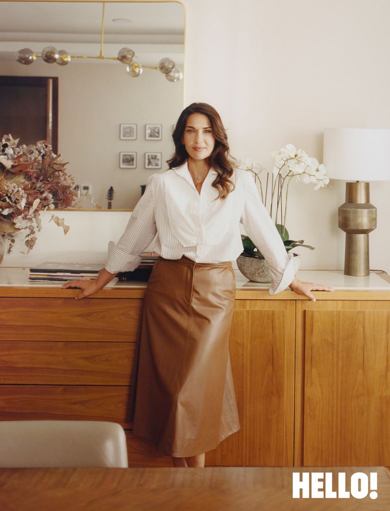 Lorena, wearing a bib front shirt by Wiggy Kit and brown faux leather skirt by Veronica Beard, lives in North London with her husband Mikel Arteta and their sons