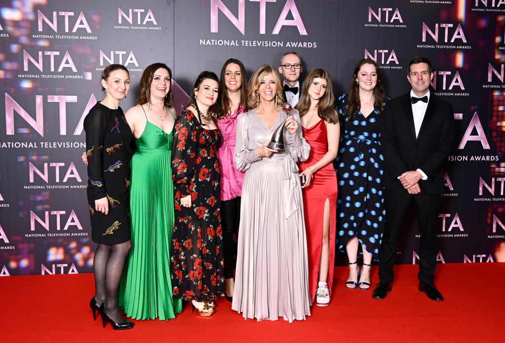 Kate holding her NTA in 2022 