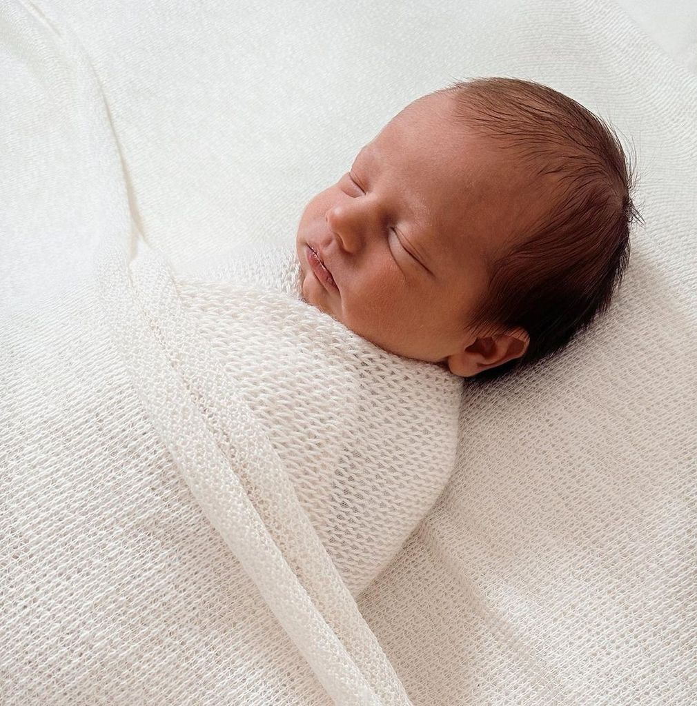 Stacey Solomon's daughter Belle wrapped in a white blanket