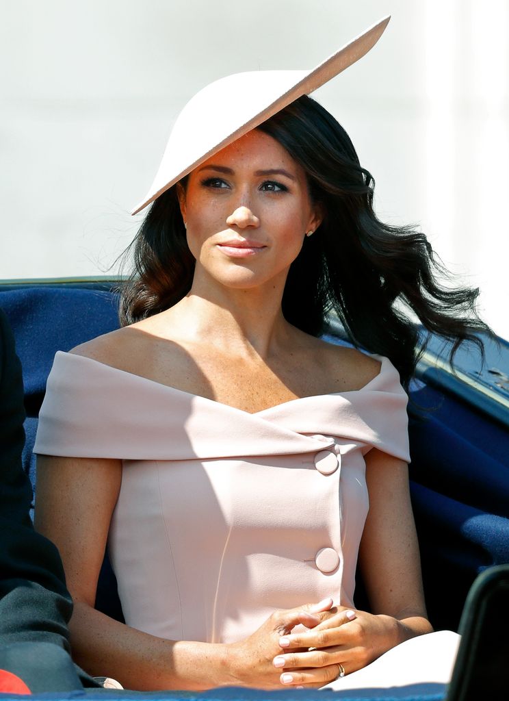 Meghan, Duchess of Sussex travels down The Mall in a horse drawn carriage during Trooping The Colour 2018 