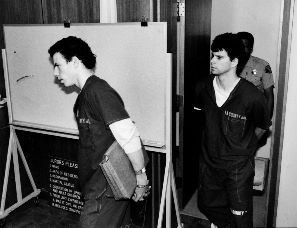 Erik Menendez, left, and his brother Lyle, wearing jail outfits, are led into courtroom. June 15, 1990