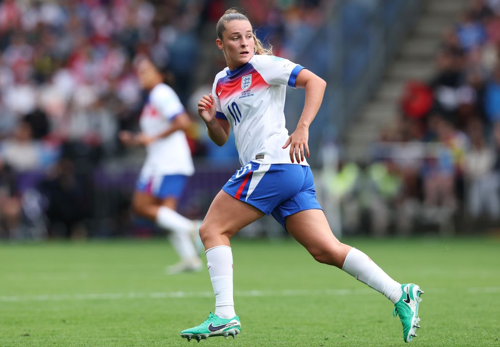 Ella running in football kit