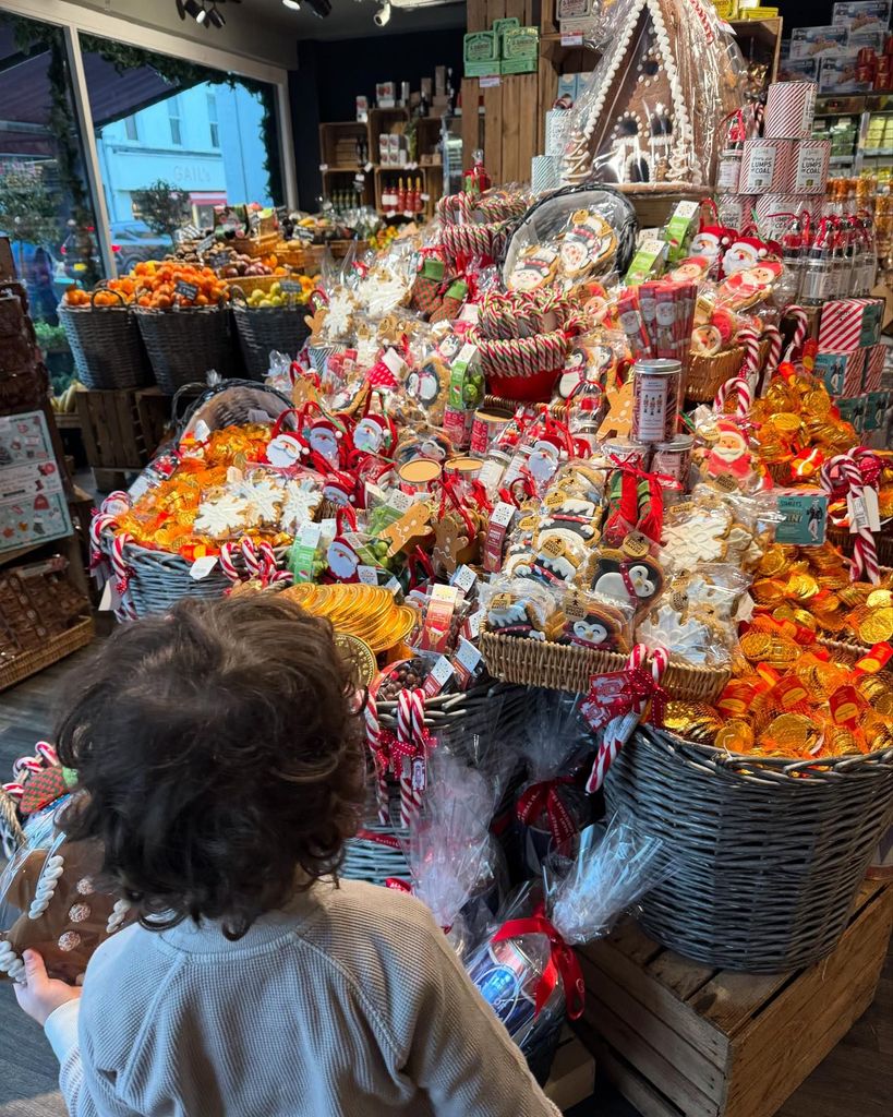 young boy looking at food display 