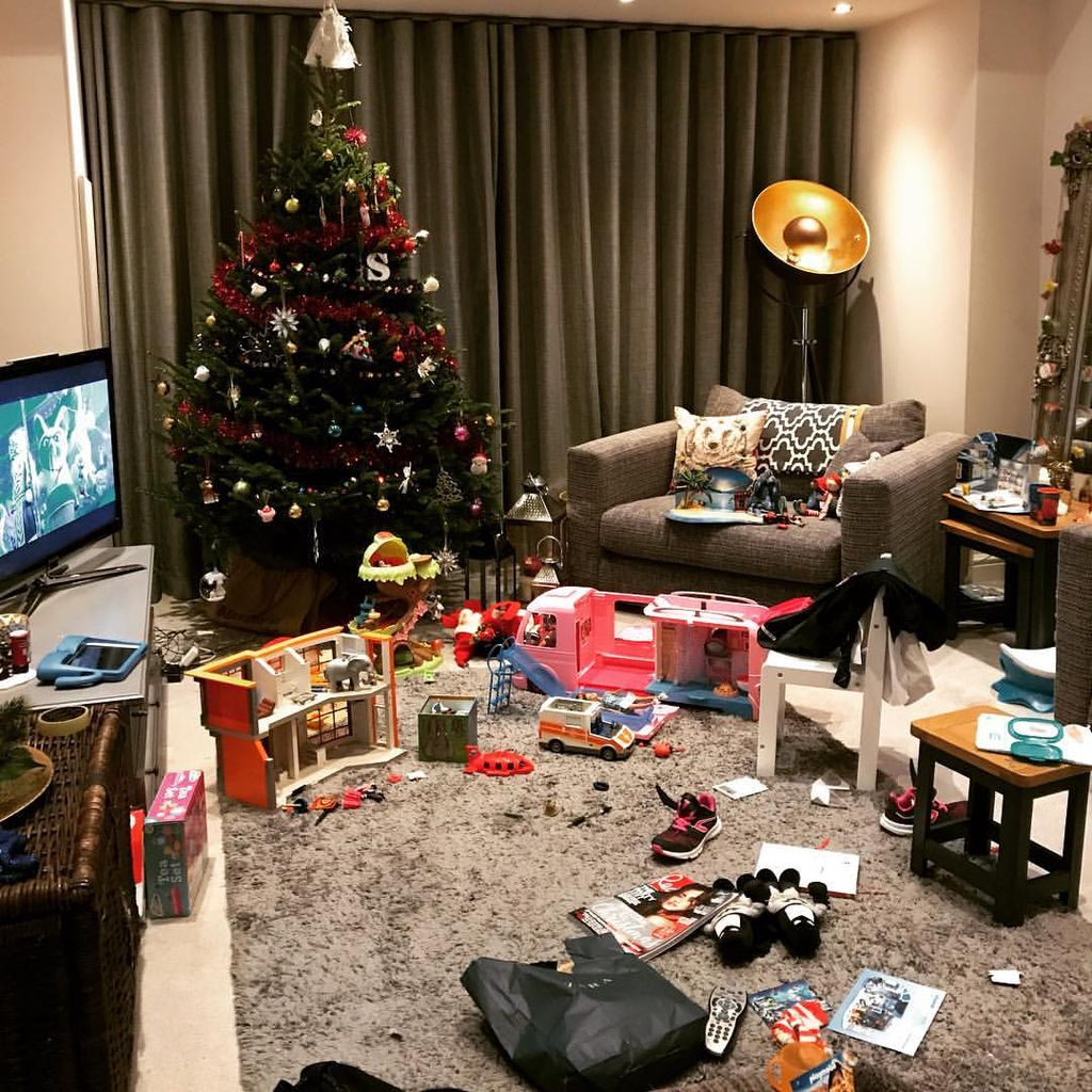 Tina O'Brien's living room covered with Christmas toys