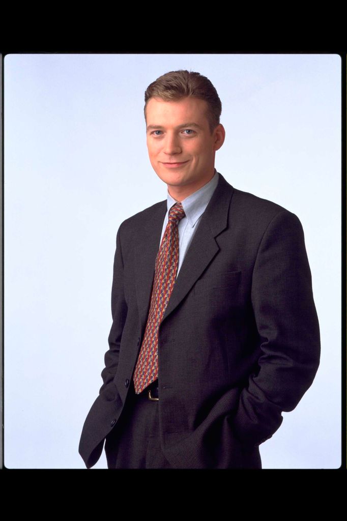 Colin Buchanan in a promotional image wearing a suit and tie