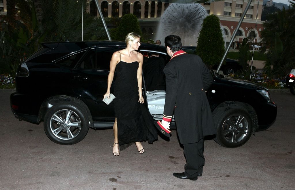 Princess Charlotte in black getting out of a car