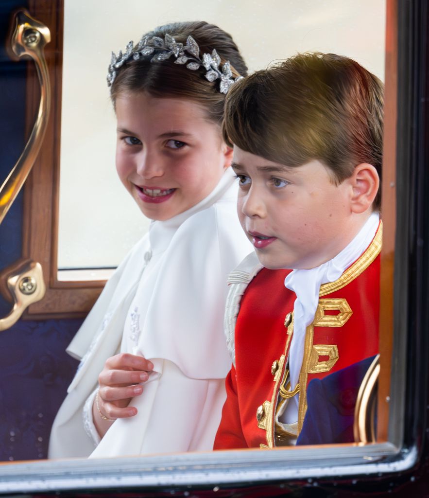 Princess Charlotte and Prince George riding in a carriage 