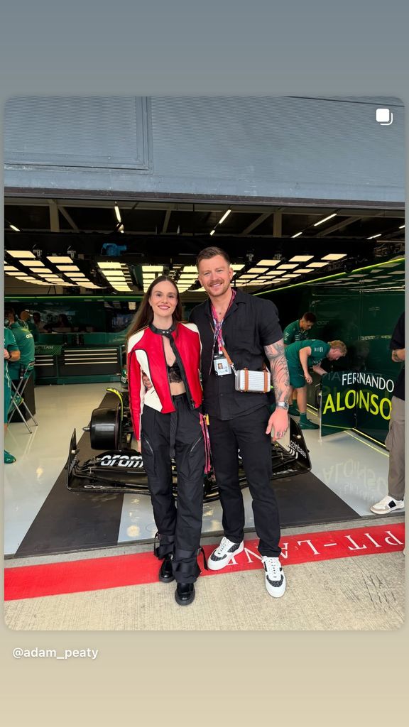 Adam Peaty with Holly Ramsay in a bralette and jacket at F1