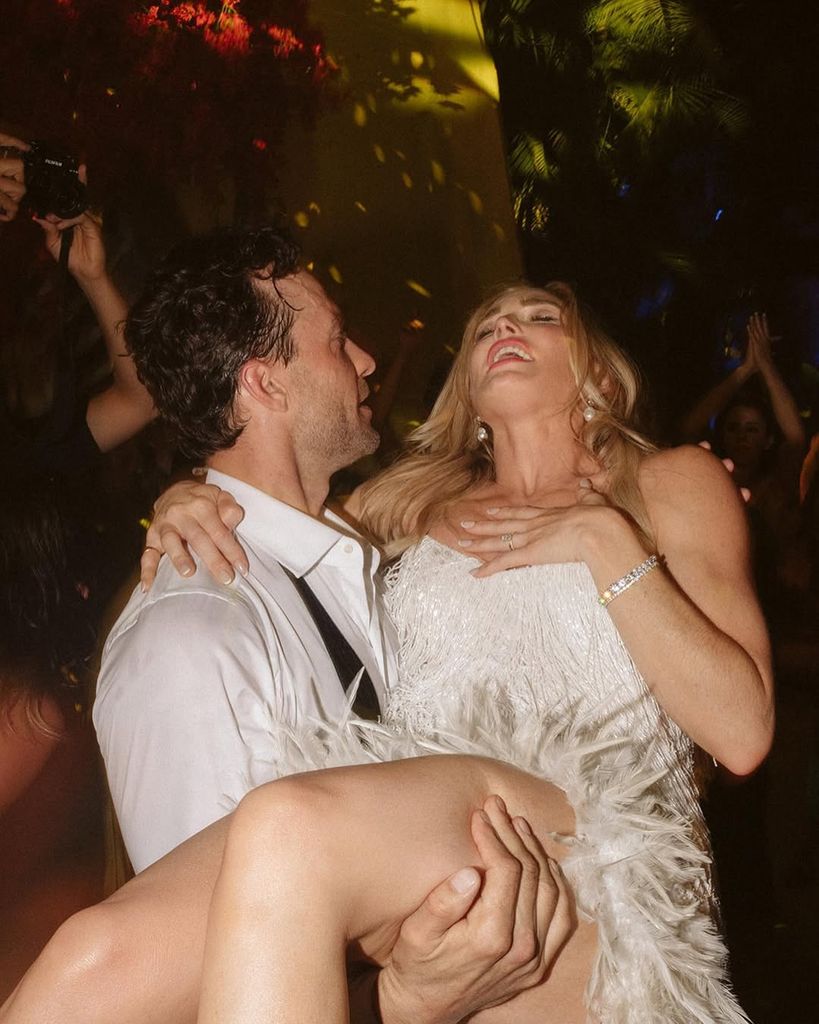 Kyle Schmid and Caity Lotz on their wedding day
