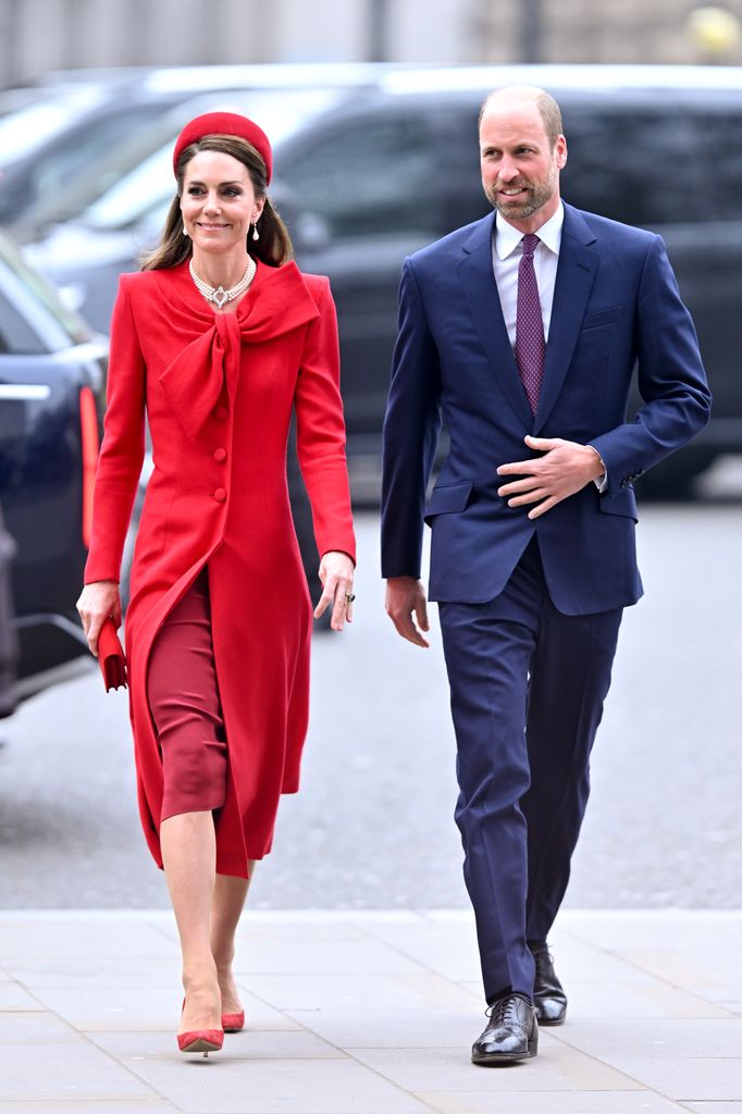 Catherine, Princess of Wales in red dress and Prince William in suit